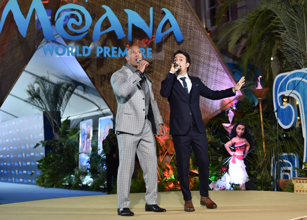 HOLLYWOOD, CA - NOVEMBER 14: Actor Dwayne Johnson (L) and songwriter Lin-Manuel Miranda perform onstage at The World Premiere of Disneys "MOANA" at the El Capitan Theatre on Monday, November 14, 2016 in Hollywood, CA. (Photo by Alberto E. Rodriguez/Getty Images for Disney) *** Local Caption *** Lin-Manuel Miranda; Dwayne Johnson